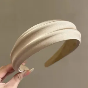 Champagne gold padded satin headband with pleated silk texture for retro hair styling