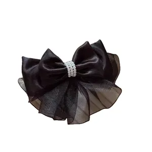 Elegant large black organza and satin layered bow hair clip with white pearl center