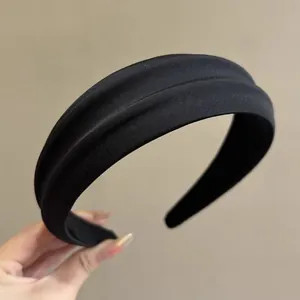 Classic black padded headband with matte fabric texture and sponge filling for women