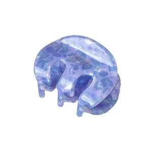Elegant marble texture acetate claw clip in blue and purple tones with gold brand logo