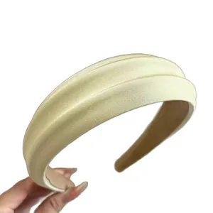 Vintage style padded sponge headband in satin champagne gold with a high top design