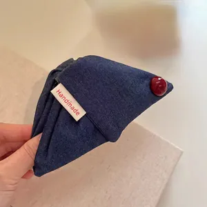 Handmade navy denim plaid shark hair claw clip with red bead accent and fabric label