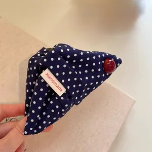 Navy blue polka dot denim hair claw clip with handmade label for women's hairstyles