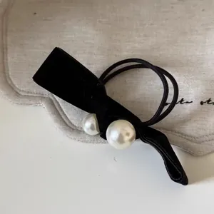 French velvet bow hair tie with white pearls and double-strand black elastic bands