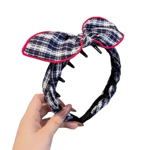 Navy blue plaid headband with a large red-edged bow and non-slip inner teeth