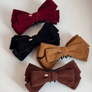 Elegant velvet bow hair clips in four colors with gold metal Love label for ponytails