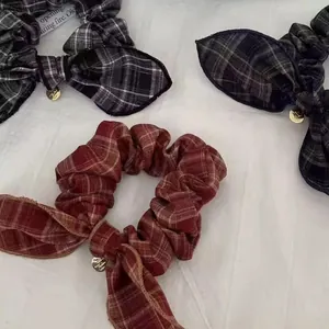 Three vintage plaid scrunchies with elegant gold charms in red, blue, and grey