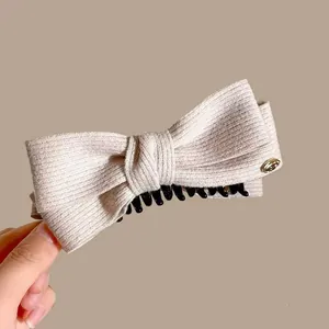 Elegant wool bow banana hair clip in beige color for high ponytail hairstyles
