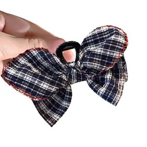 Blue and white plaid bow hair claw clip with red jagged trim for women hair styling