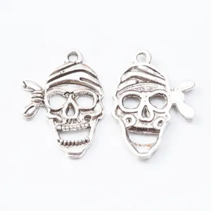 Pair of retro silver zinc alloy skull charms with bandana design for DIY jewelry making