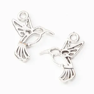 Pair of vintage silver hummingbird charms in alloy metal for DIY jewelry making and crafts