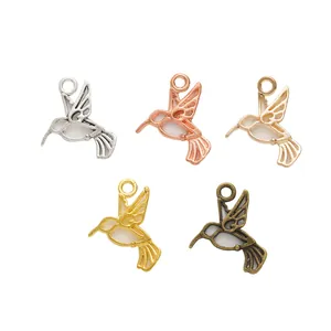 Five-piece set of vintage hummingbird alloy pendants in various metallic plated finishes