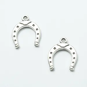 Pair of retro zinc alloy horseshoe pendants with a vintage silver finish for DIY jewelry