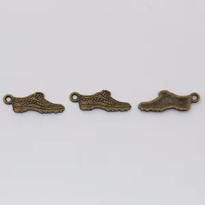Vintage bronze sneaker alloy pendants with intricate textured details for DIY jewelry making