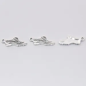 Three vintage silver shoe pendants made of alloy for DIY jewelry and keychain projects