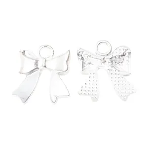 Front and back view of silver bow-knot charms with textured finish for jewelry DIY