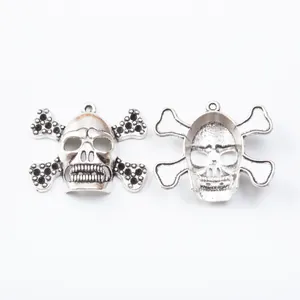 Vintage silver skull and crossbones alloy charm with top loop for DIY jewelry making