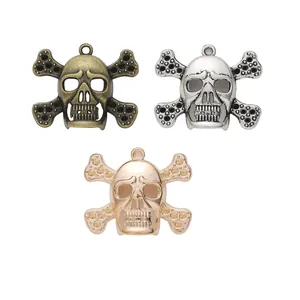 Zinc alloy skull and crossbones pendants in bronze, silver and gold metal finishes