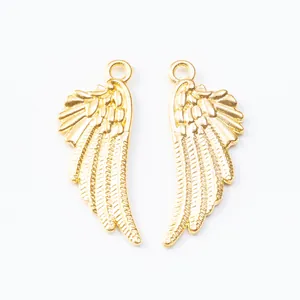 Symmetric golden angel wing alloy pendants with detailed feather texture and top hanging loops