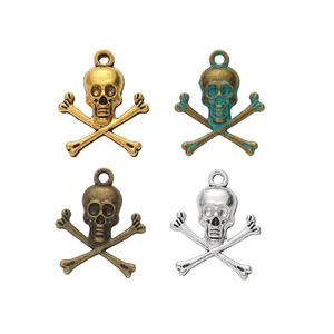 Skull and crossbones charms in gold, silver, and bronze for DIY jewelry making