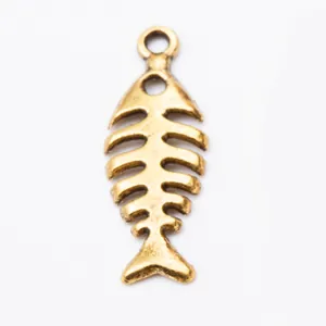 Detailed view of vintage bronze fish bone pendant with top loop for DIY jewelry making