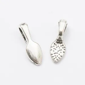 Macro detail of antique silver alloy bails for jewelry making with textured back