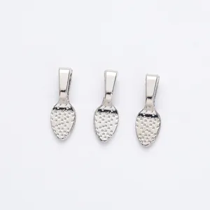 Close-up of three silver plated alloy pinch bails with textured teardrop detail for DIY jewelry