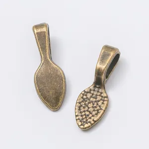 Anhänger aus Retro-Bronze-Legierung in Schaufelform mit geprägter Vintage-Textur und Ösen