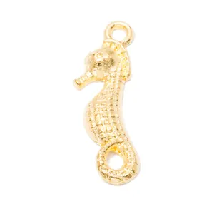 Golden metal seahorse pendant with textured grid pattern and fixed round hanging ring