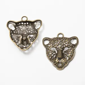 Pendentif tête de léopard bronze vintage avec motif évidé et anneau pour bijoux DIY
