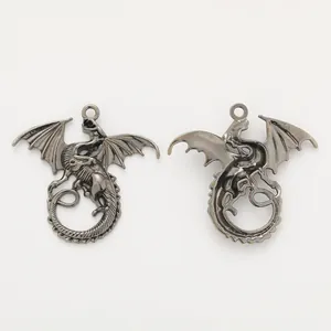 Front and back detail of vintage zinc alloy flying dragon pendants for DIY jewelry