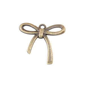 Vintage bronze zinc alloy bow pendant with hanging loop for DIY jewelry making