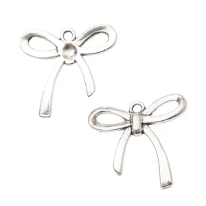 Vintage silver bow metal charm pendants with round hanging holes for DIY jewelry making