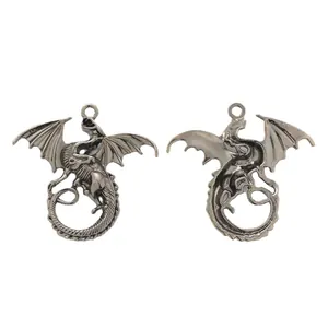 Pair of vintage silver dragon pendants with wings for DIY necklace and jewelry making
