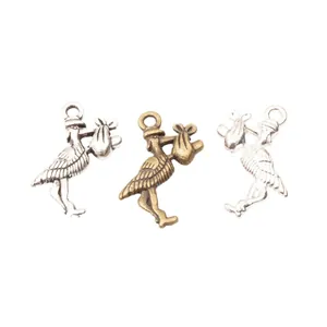 Three antique finish metal stork charms for DIY jewelry making in silver and bronze colors