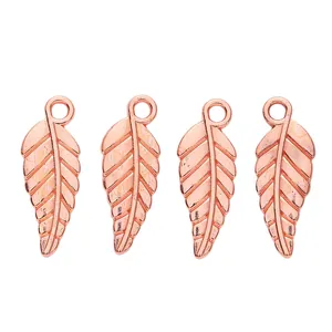 Detail showing four rose gold alloy leaf pendants with clear vein patterns for DIY jewelry
