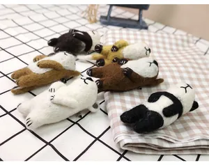 Detailed texture of handmade wool felt animal brooches with cute panda and bear designs
