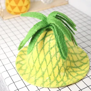Handmade wool felt pineapple hat for women with green leaf details and textured patterns