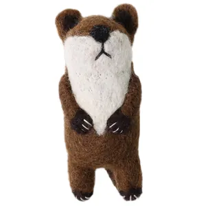 Handmade wool felt brown bear brooch pin with detailed white chest and cute fuzzy texture