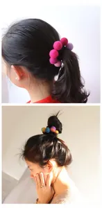 Detail of colorful handmade wool felt ball hair ties showing texture and various colors