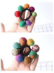 Close-up of soft handmade wool felt ball hair ties with colorful fuzzy textures