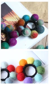Detailed macro view of colorful handmade wool felt balls on high-elastic hair ties