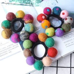 Handmade colorful wool felt ball hair ties set with vibrant polka dot accents