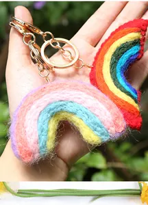 Macro view of handmade rainbow wool felt keychains in vibrant and macaron tones
