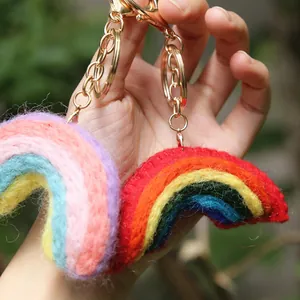 Handmade wool felt rainbow keychains with golden metal clips and soft macaron colors