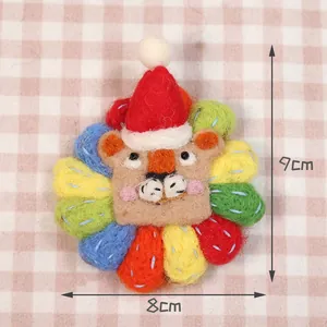 Detailed view showing the 8x9cm size of a handmade wool felt lion Christmas brooch