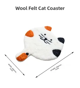 Detail of wool felt calico cat coaster showing dimensions 15cm x 12cm on white background