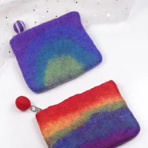 Handmade wool felt rainbow coin purses with colorful gradient design and zipper closure