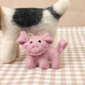 Handmade pink wool felt pig brooch with soft texture for coats and clothing decoration