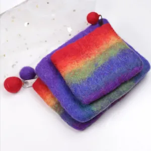 Three-piece set of handmade rainbow wool felt coin purses with vibrant gradient colors